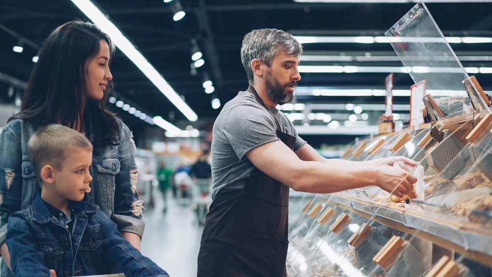 Family shopping at a retail food display